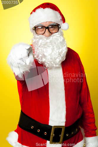 Image of Jelly-belly Santa in spectacles pointing at you