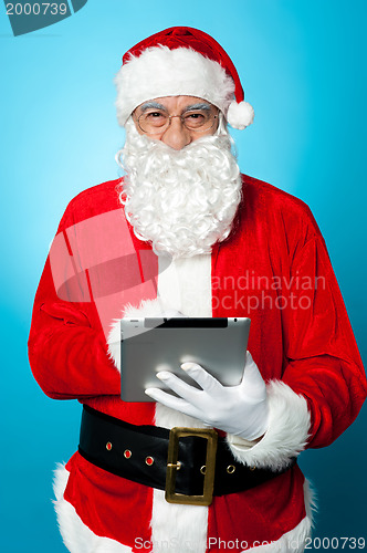 Image of Modern Santa using digital touch screen device