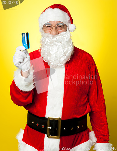 Image of Male in Santa costume posing with his cash card