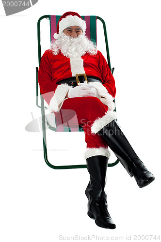 Image of Isolated aged Santa relaxing. Vacation time