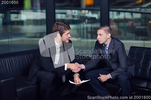 Image of business people making deal
