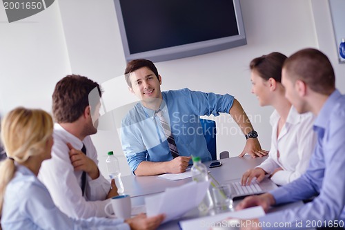 Image of business people in a meeting at office