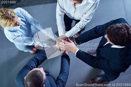 Image of business people group joining hands