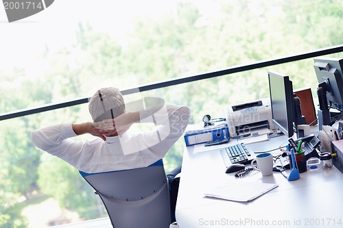 Image of happy young business man at office