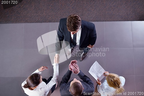 Image of business people making deal