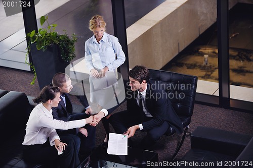 Image of business people making deal