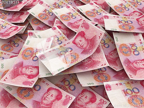 Image of Chinese 100 Yuan bill face within pile of other 100 Yuan bills 