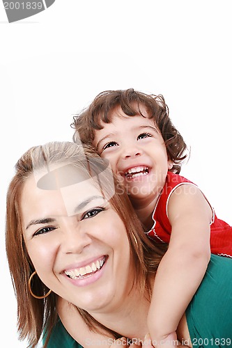 Image of Portrait of happy daughter enjoying a piggyback ride on mothers 