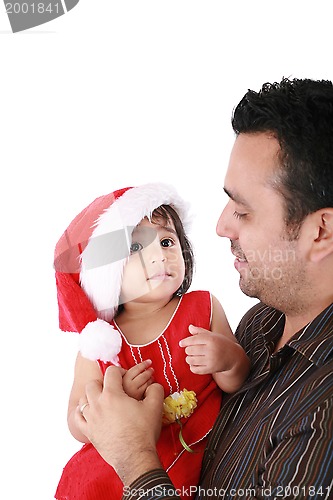 Image of Father and daughter looking happy wearing santa Christmas hat.  
