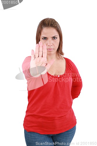 Image of Isolated young woman stop sign, focus on hand