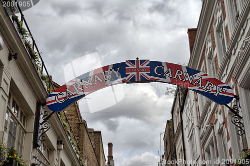 Image of Carnaby Street Sign with Buildings on a overcast autumn afternoo