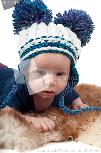 Image of Little baby in pom-pon hat
