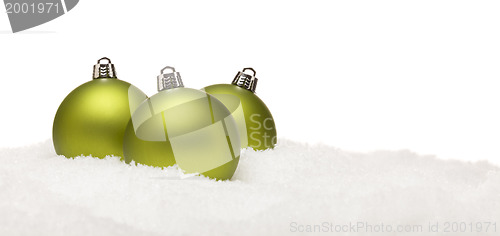 Image of Green Christmas Ornaments on Snow Flakes Isolated on White