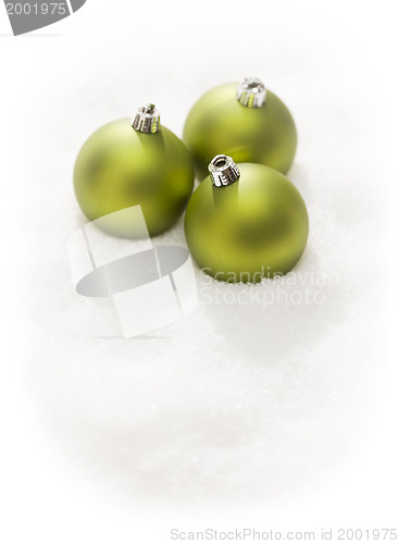 Image of Green Christmas Ornaments on Snow Flakes Isolated on White