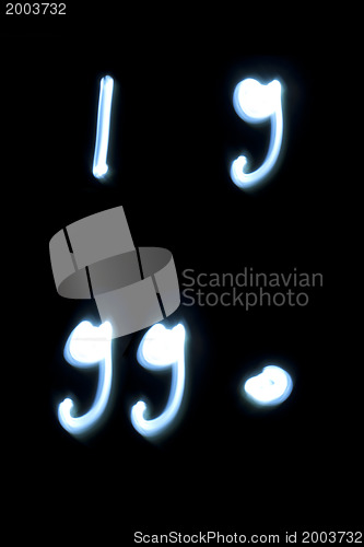 Image of Comma, point and quotes symbols from neon light. 