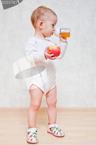 Image of Baby girl with healthy food at home