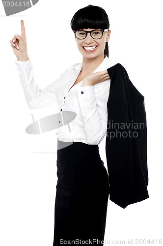 Image of Lively female entrepreneur pointing upwards