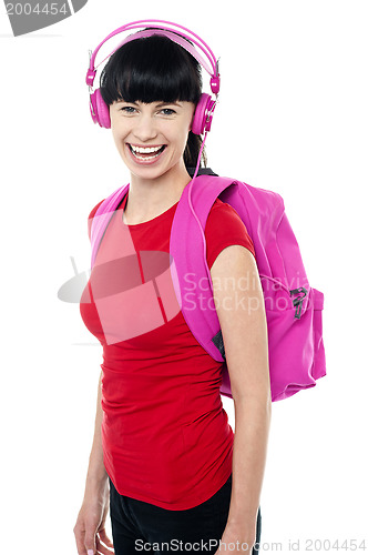 Image of Student enjoying music on her way to college