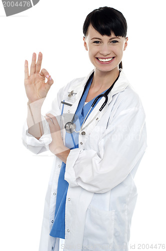 Image of Smiling medical practitioner showing perfect sign