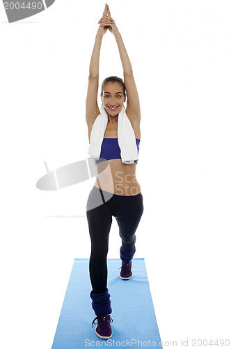 Image of Fit woman doing stretching exercise