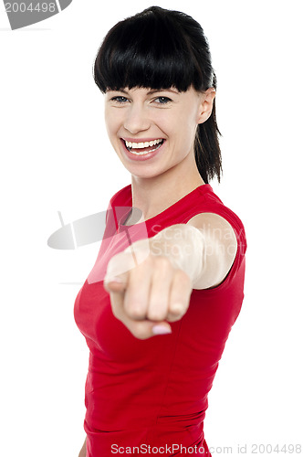 Image of Attractive cheerful woman pointing at you