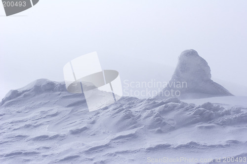 Image of snow drift at top of mountain