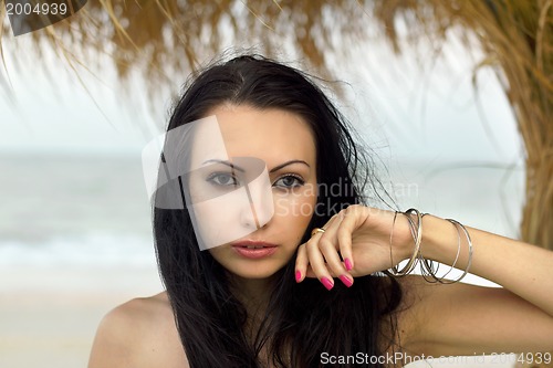 Image of attractive young woman on the beach