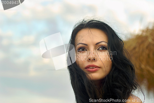 Image of beautiful young woman on the beach