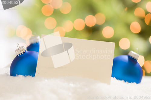 Image of Blue Christmas Ornaments Behind Blank Off-white Card