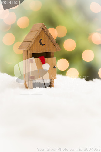 Image of Santa in An Outhouse on Snow Over and Abstract Background