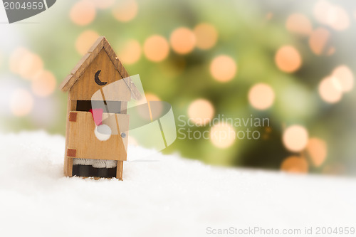 Image of Santa in An Outhouse on Snow Over and Abstract Background