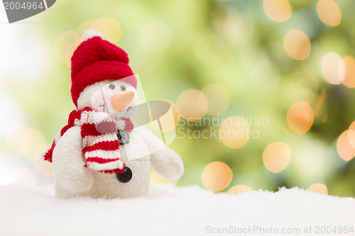 Image of Cute Snowman Over Abstract Background