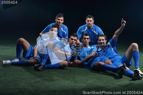 Image of soccer players celebrating victory