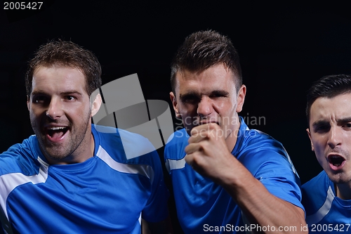 Image of soccer players celebrating victory
