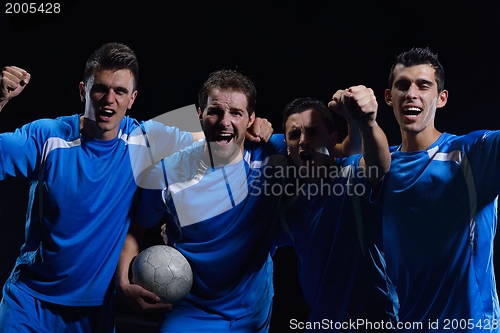 Image of soccer players celebrating victory