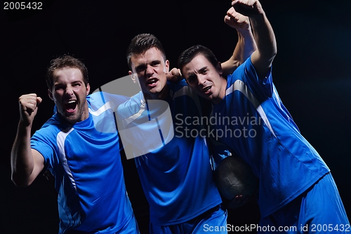 Image of soccer players celebrating victory