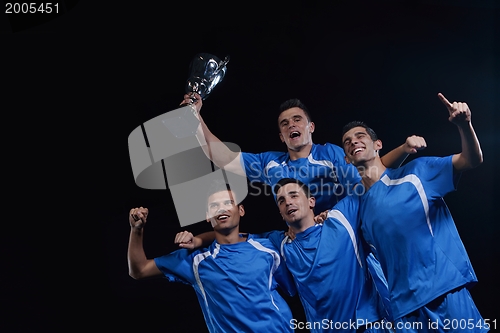 Image of soccer players celebrating victory