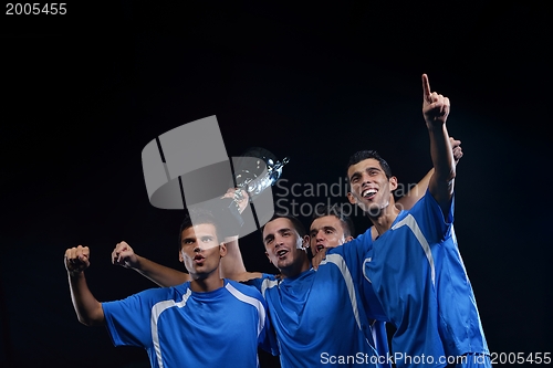 Image of soccer players celebrating victory