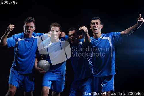 Image of soccer players celebrating victory