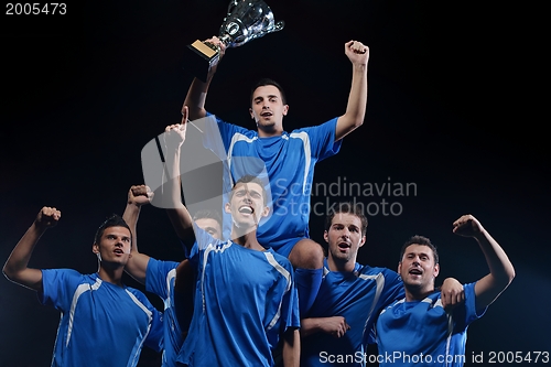 Image of soccer players celebrating victory
