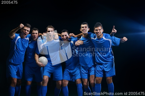 Image of soccer players celebrating victory