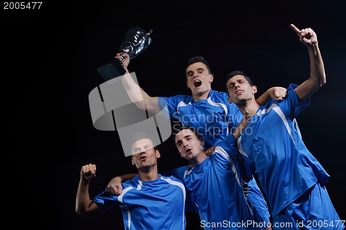 Image of soccer players celebrating victory