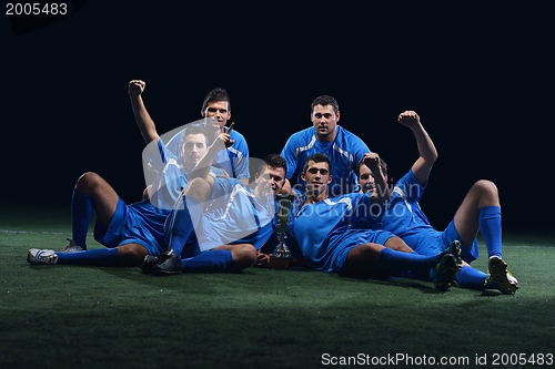 Image of soccer players celebrating victory