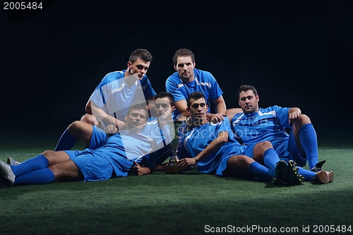 Image of soccer players celebrating victory