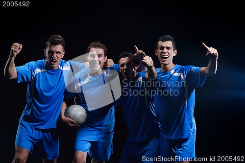 Image of soccer players celebrating victory