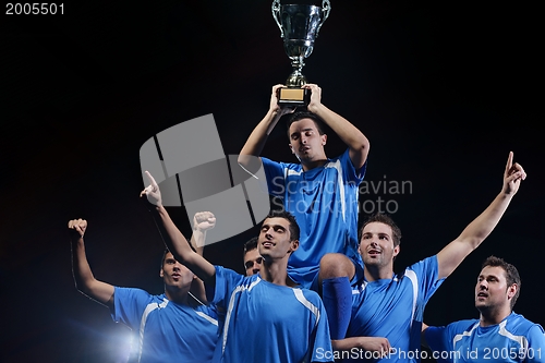Image of soccer players celebrating victory