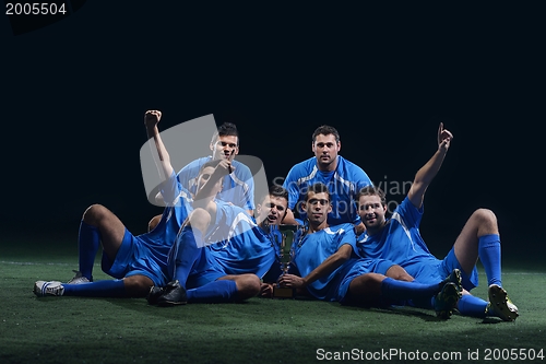 Image of soccer players celebrating victory