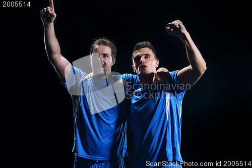Image of soccer players celebrating victory