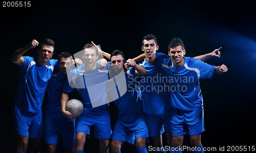 Image of soccer players celebrating victory