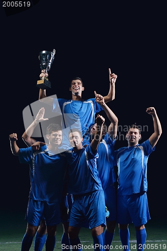 Image of soccer players celebrating victory